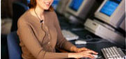 Image of a woman at a desk.